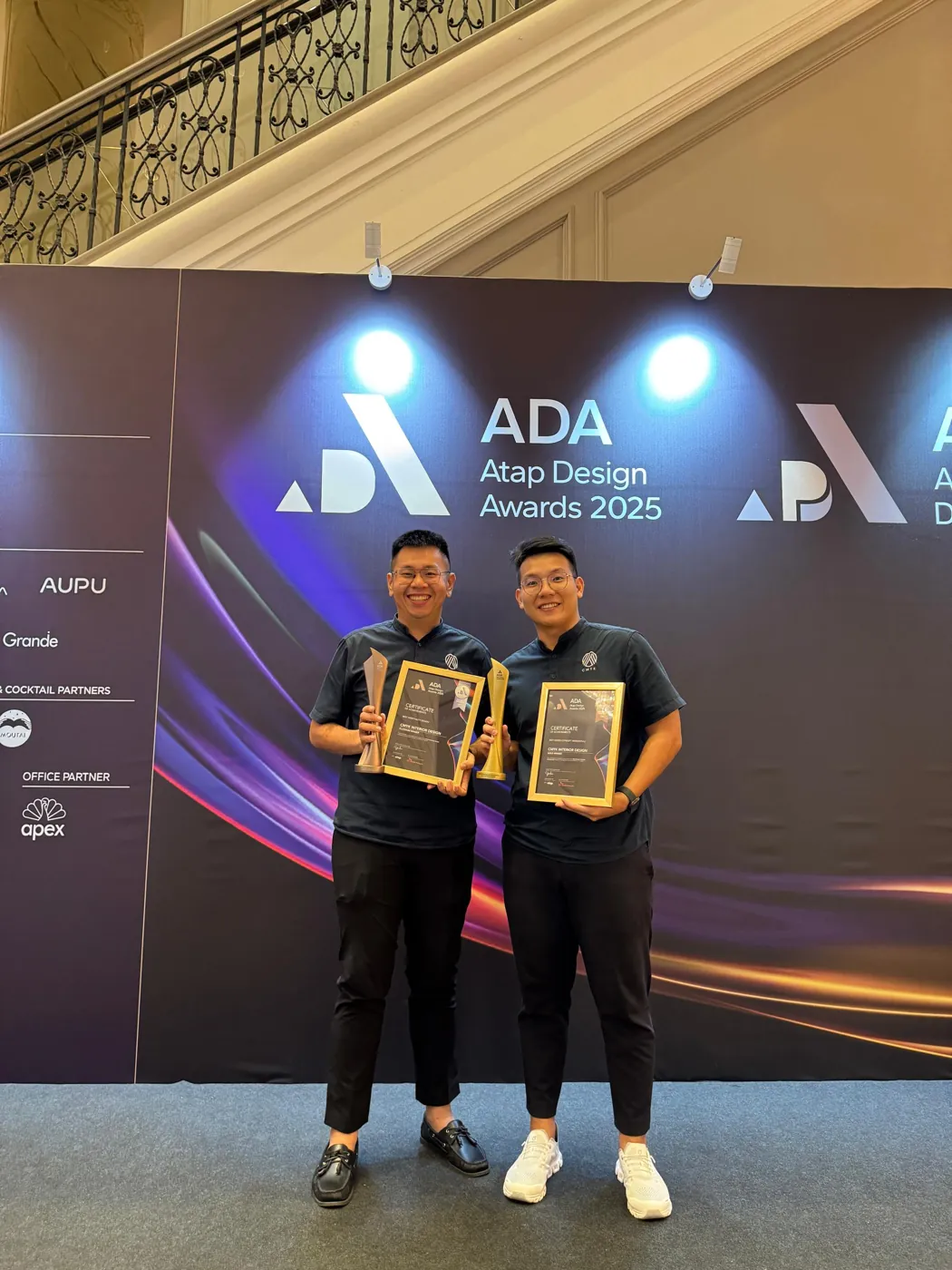 The CMYK team with the Platinum and Gold trophies at the Atap Design Awards 2025